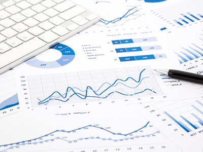 Financial graphs on table near a keyboard